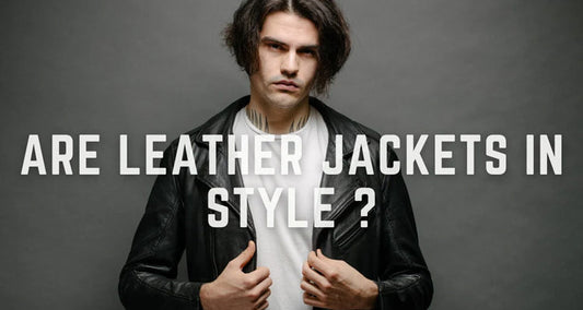 A stylish man wearing an airforce shearling jacket, paired with denim jeans and boots, showcasing the latest leather jacket trends in 2025.