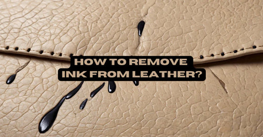 Leather jacket with an ink stain being cleaned using a soft cloth, demonstrating effective methods to remove ink from leather surfaces.