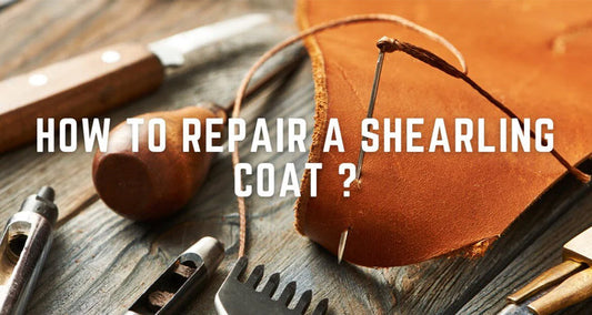 A person repairing a shearling coat by stitching a leather patch onto a torn section, ensuring durability and seamless restoration of the classic outerwear.