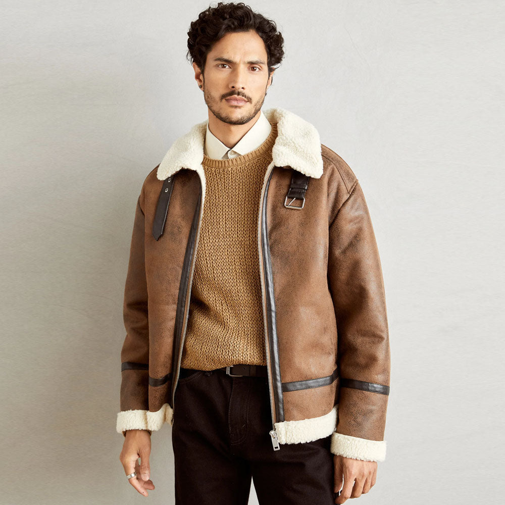 Close-up of shearling leather jacket showing wool lining and leather exterior; history, styles, and tips on how to wear shearling jackets.