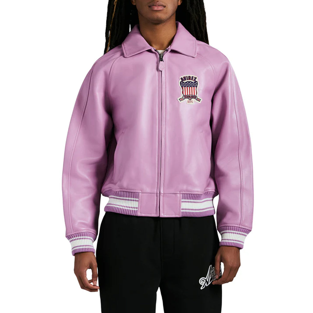 Person wearing a purple varsity jacket with a logo on a white background
