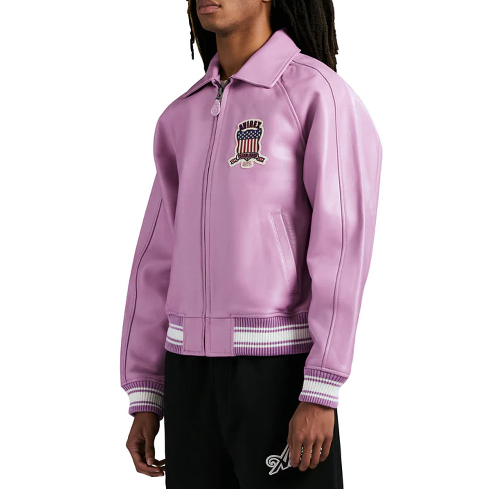 Person wearing a purple jacket with a logo on a white background