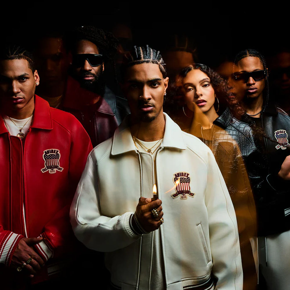 Group of people wearing branded jackets with a dark background