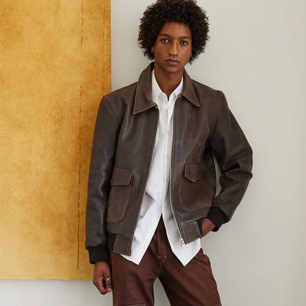 Front view of a man wearing the RAF Vintage A2 Brown Leather Bomber Jacket, showcasing the classic collar and ribbed trims.