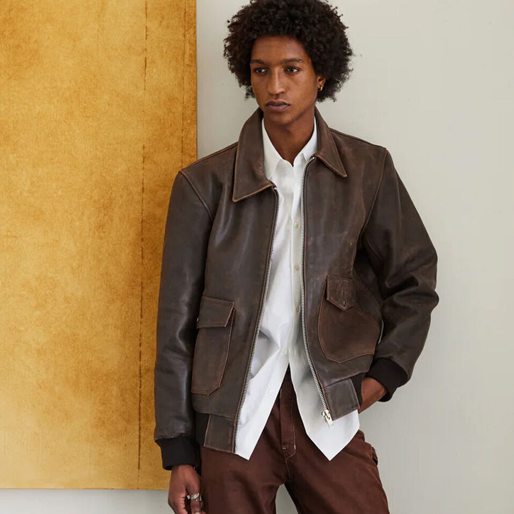 Man wearing the RAF Vintage A2 Brown Leather Bomber Jacket, looking to the side, highlighting the premium vintage leather finish.