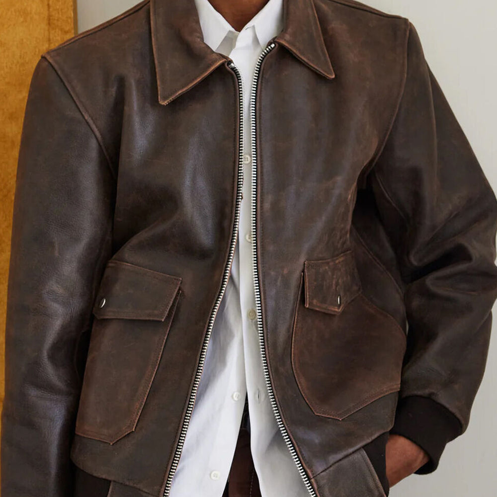 Close-up front view of a man wearing the RAF Vintage A2 Brown Leather Bomber Jacket with the front closure zipped.