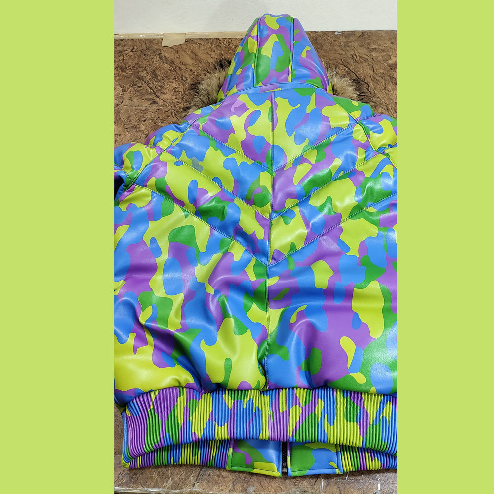 Back shot of the Men's Sheepskin Leather V-Bomber Jacket, emphasizing the camo pattern, fur-trimmed hood, and structured design.