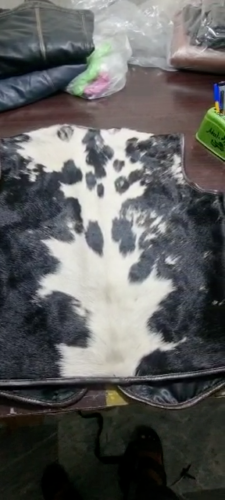Men’s Cowhide Leather Vest laid flat showing the back side – Premium Hair-On Leather, Durable Stitching, and Unique Pattern Design.