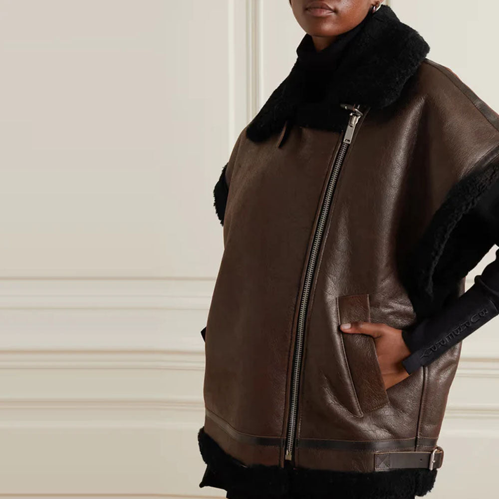 A woman wearing a Dark Brown Shearling Leather Sheepskin Vest with a front closure zip fully closed, slightly posing to the side.