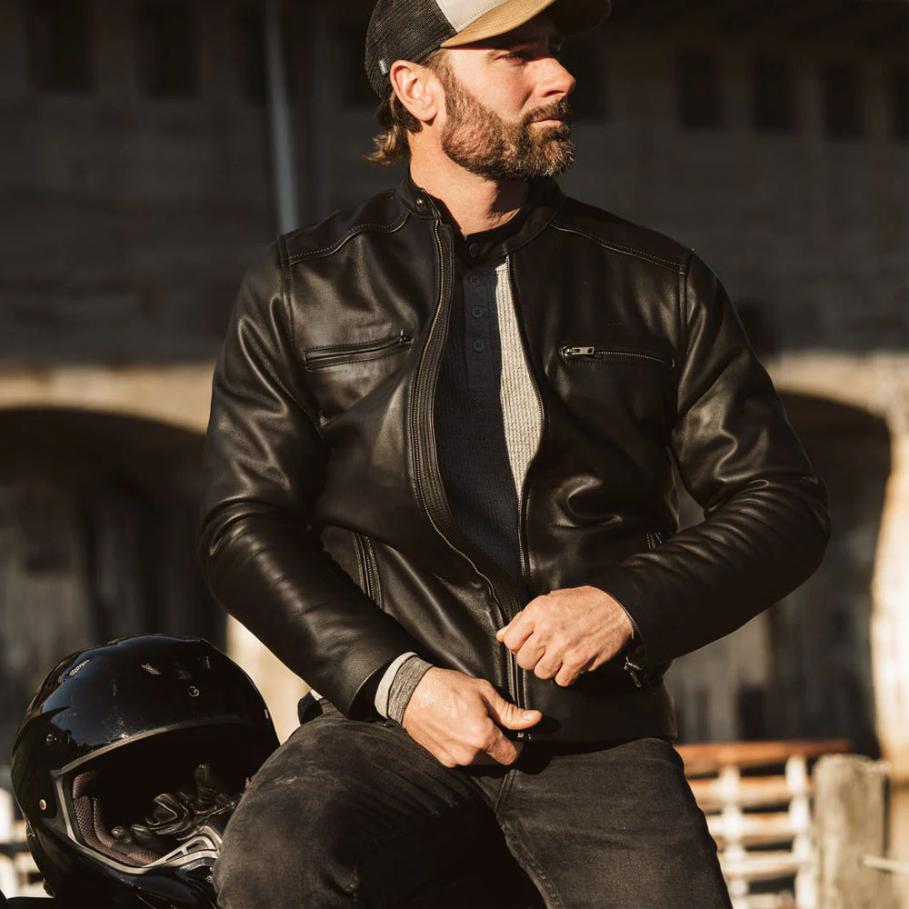 Vintage-inspired black bomber jacket with a stylish collar and cuffs.