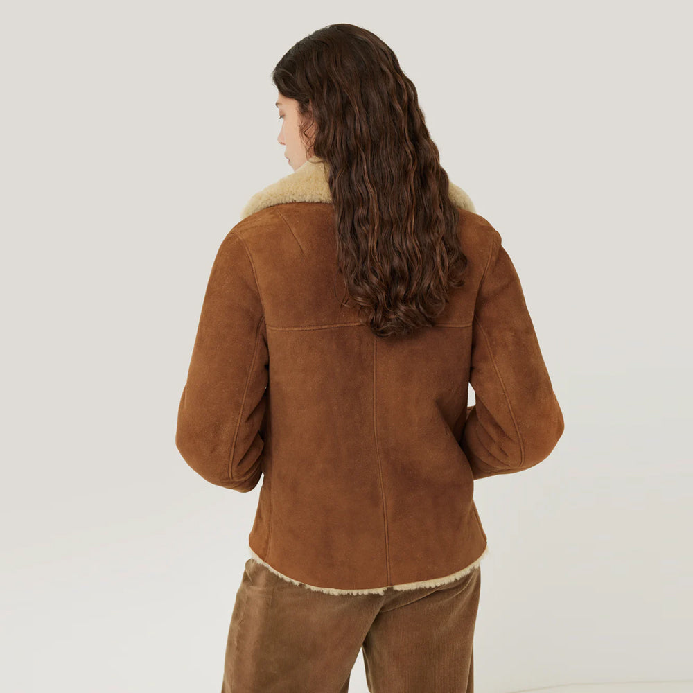 Back view of stylish women's brown shearling suede leather jacket.