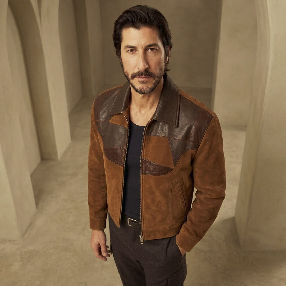 High-angle view of brown lambskin patchwork jacket highlighting the point collar, sculpted chocolate leather yoke and suede body.