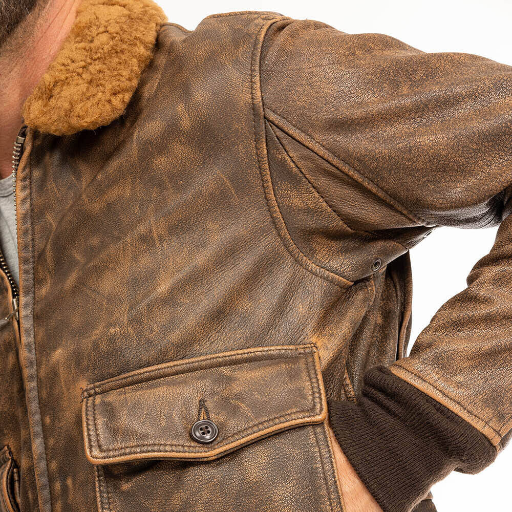 Macro close-up view of underarm ventilation eyelet and bi-swing back sleeve construction on G-1 leather flight jacket.