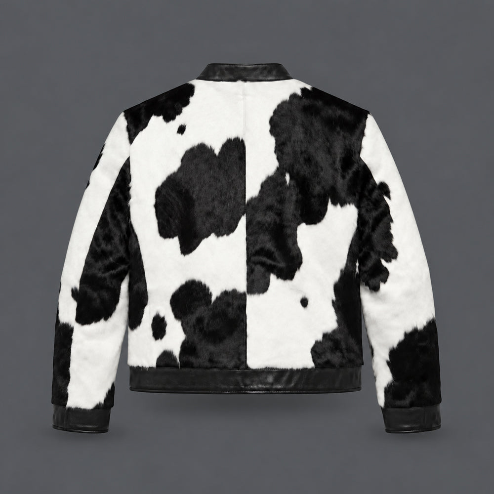 Back view of black and white hair-on-hide moto jacket with center seam and black leather hem