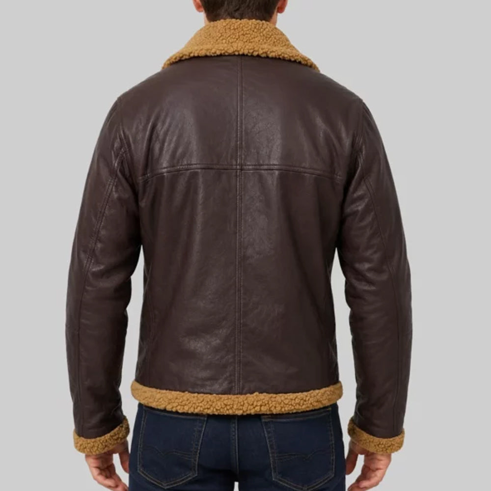 Rear view of model wearing brown B3 aviator leather jacket displaying T-shaped back seam pattern and mustard fleece hem