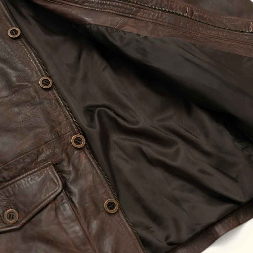 Interior detail of top-grain goatskin workwear jacket with smooth dark polyester lining, zipper tape and vintage-style buttons