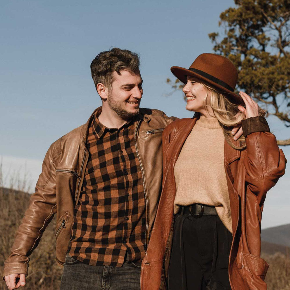 A stylish leather bomber jacket featured in a clean, modern setting. Perfect for showcasing its timeless appeal, versatility, and durable craftsmanship.