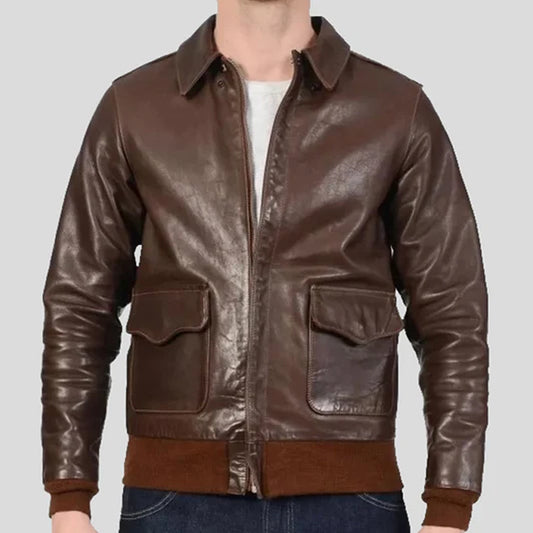 Classic leather bomber jacket displayed on a hanger, showcasing its premium leather material, ribbed cuffs, and timeless flight-inspired design.