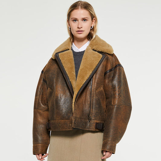 Women wearing a warm shearling leather jacket outdoors, showcasing the insulation, durability, and timeless style that make it a winter essential.