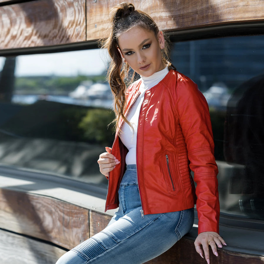 Women's orange cafe racer leather moto jacket with a streamlined zip-front design