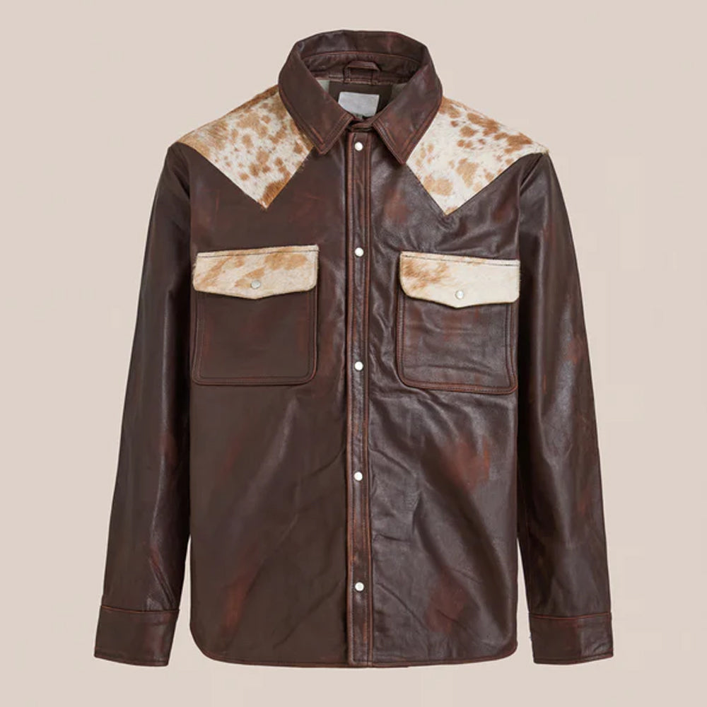 Brown leather shirt with cowhide accents on a beige background