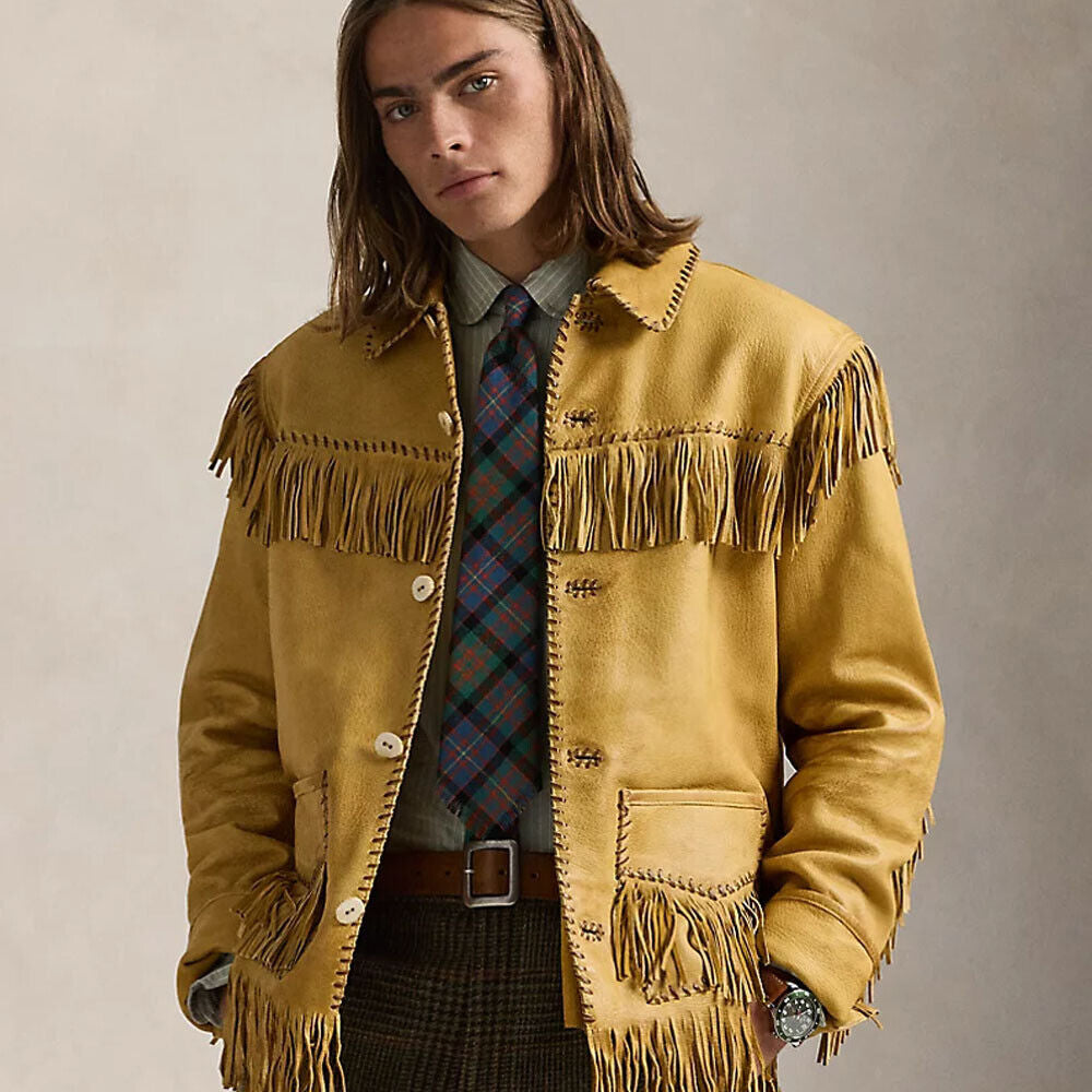 Model wearing handcrafted Western leather fringe jacket with open button closure, showcasing intricate beadwork and fringe detailing.