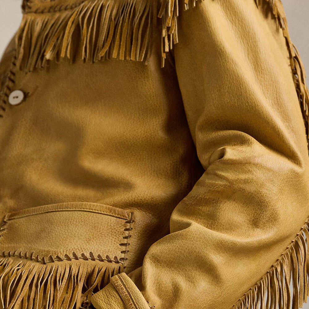 Close-up of fringe detailing on genuine leather Western cowboy jacket.