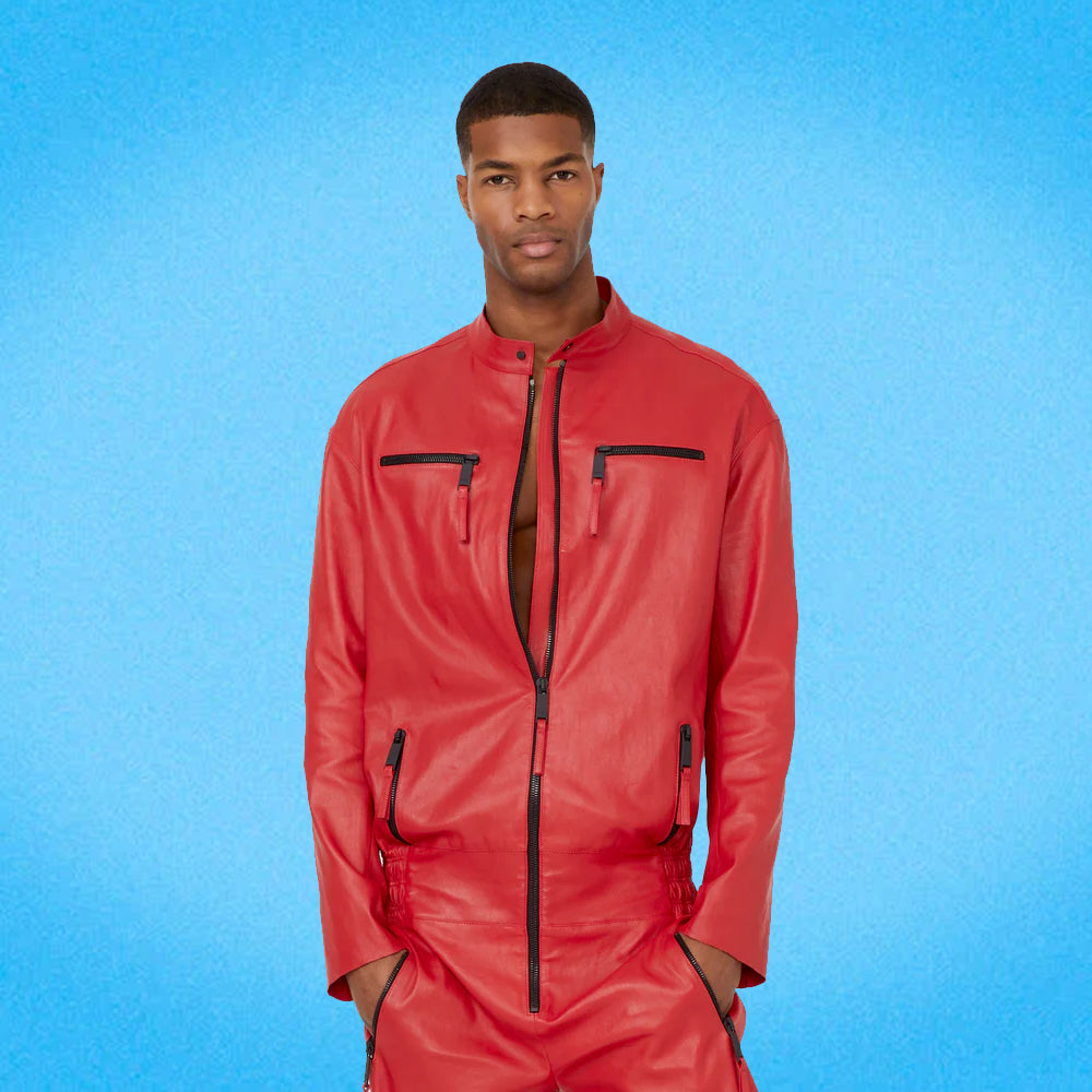 Close-up of the red leather jumpsuit, focusing on the premium genuine leather texture, detailed stitching, and contrast zipper accents.