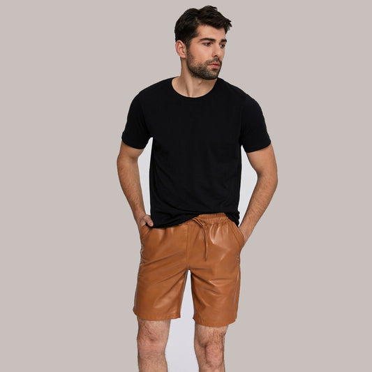 Man modeling Men’s Genuine Sheepskin Leather Shorts in a front view, showcasing sleek design and casual style.