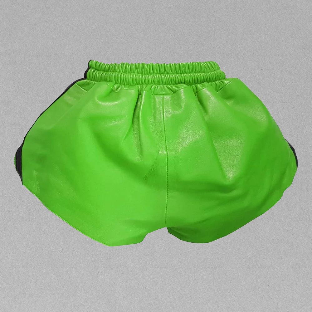 Backside of men's green leather shorts featuring a smooth lambskin texture, elastic waistband, and a sleek, modern fit.