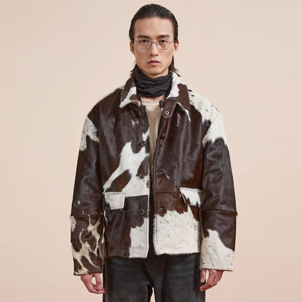 Brown and white cowhide jacket with button closure and patch pockets for western style fashion