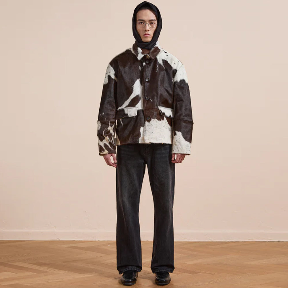 Brown white spotted cowhide jacket with button front and western ranch aesthetic