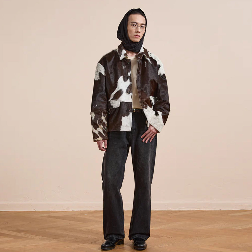 Authentic western cowhide jacket with natural fur texture and workwear details
