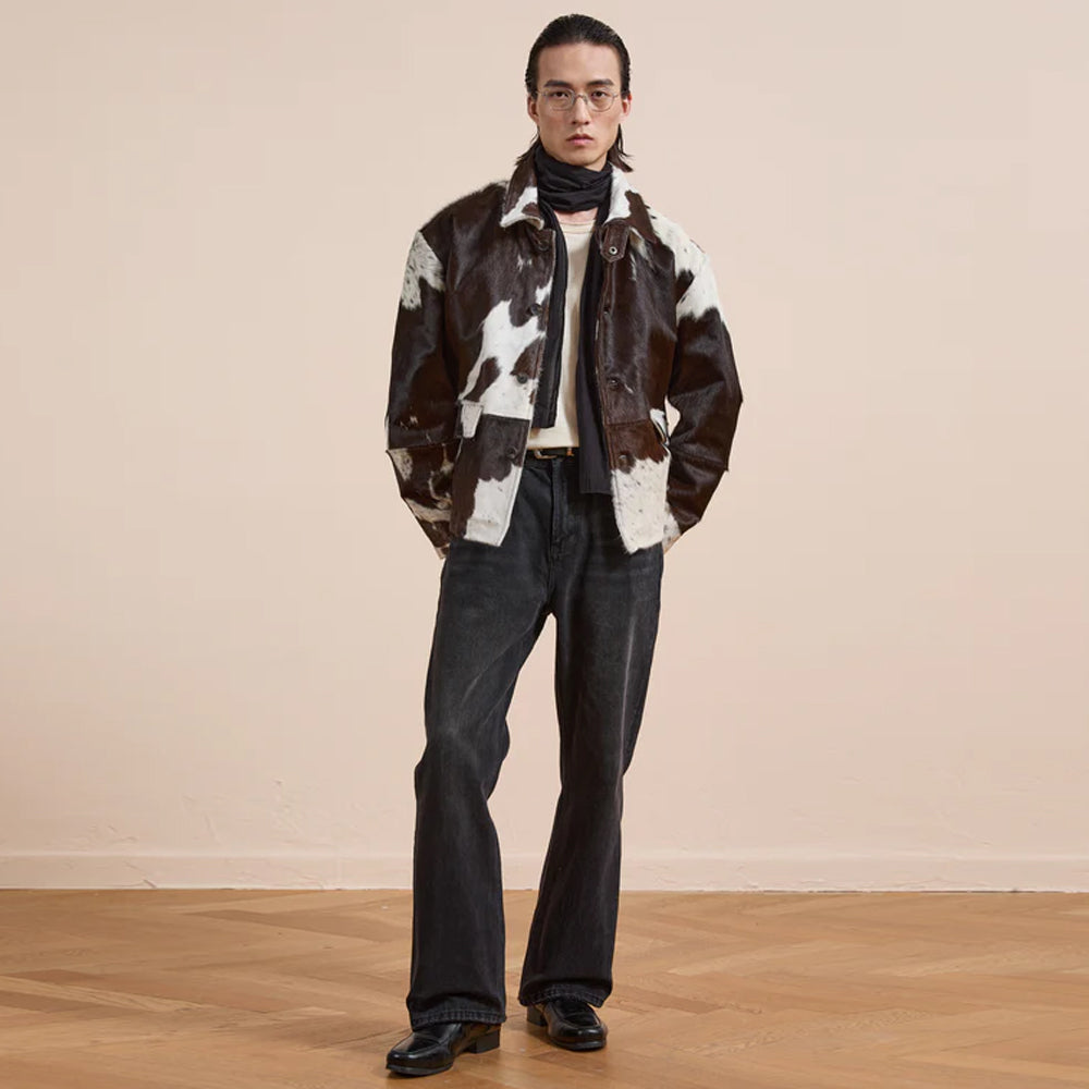 Designer cowhide leather jacket with authentic animal print and structured shoulders