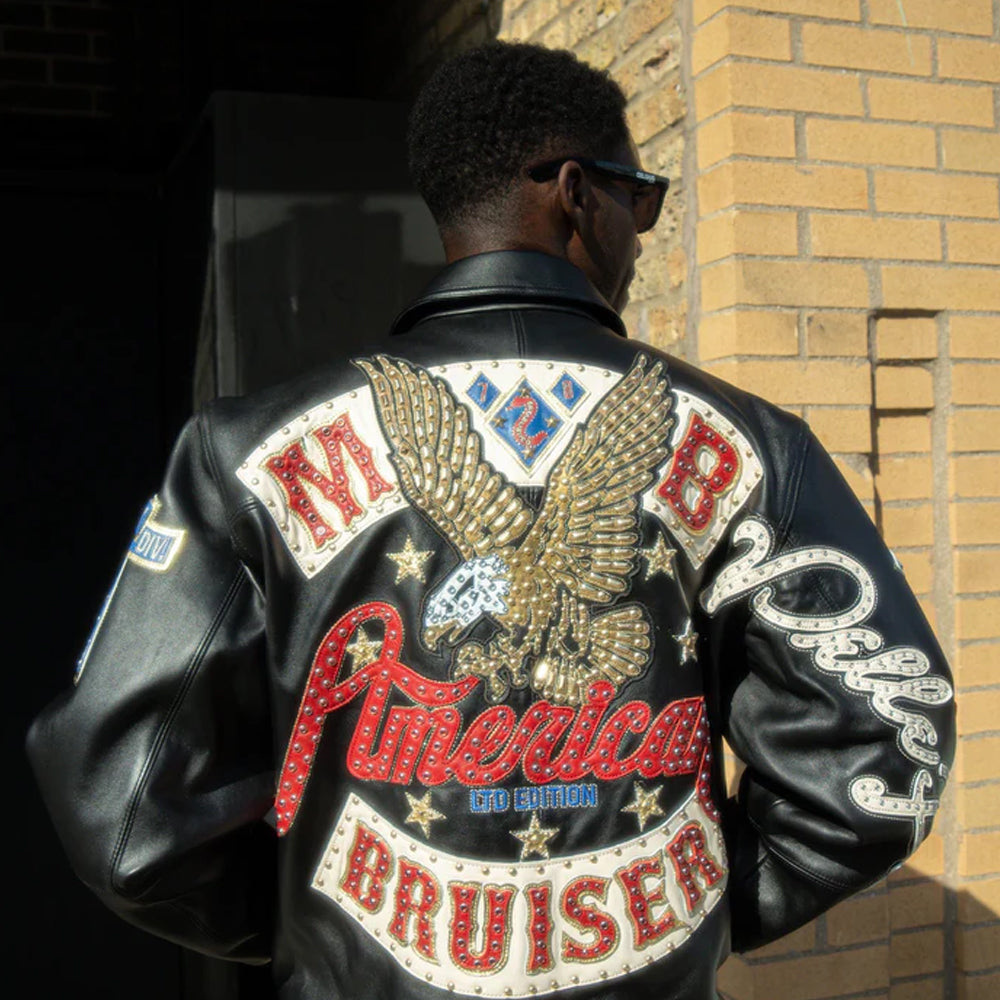 Person wearing a black leather jacket with American Bruiser branding and an eagle emblem.
