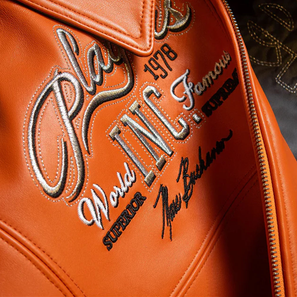 Pelle Pelle Players Orange Leather Jacket Embroidery Close-Up – Leather Applied Players Inc Artwork with Print and Stitching
