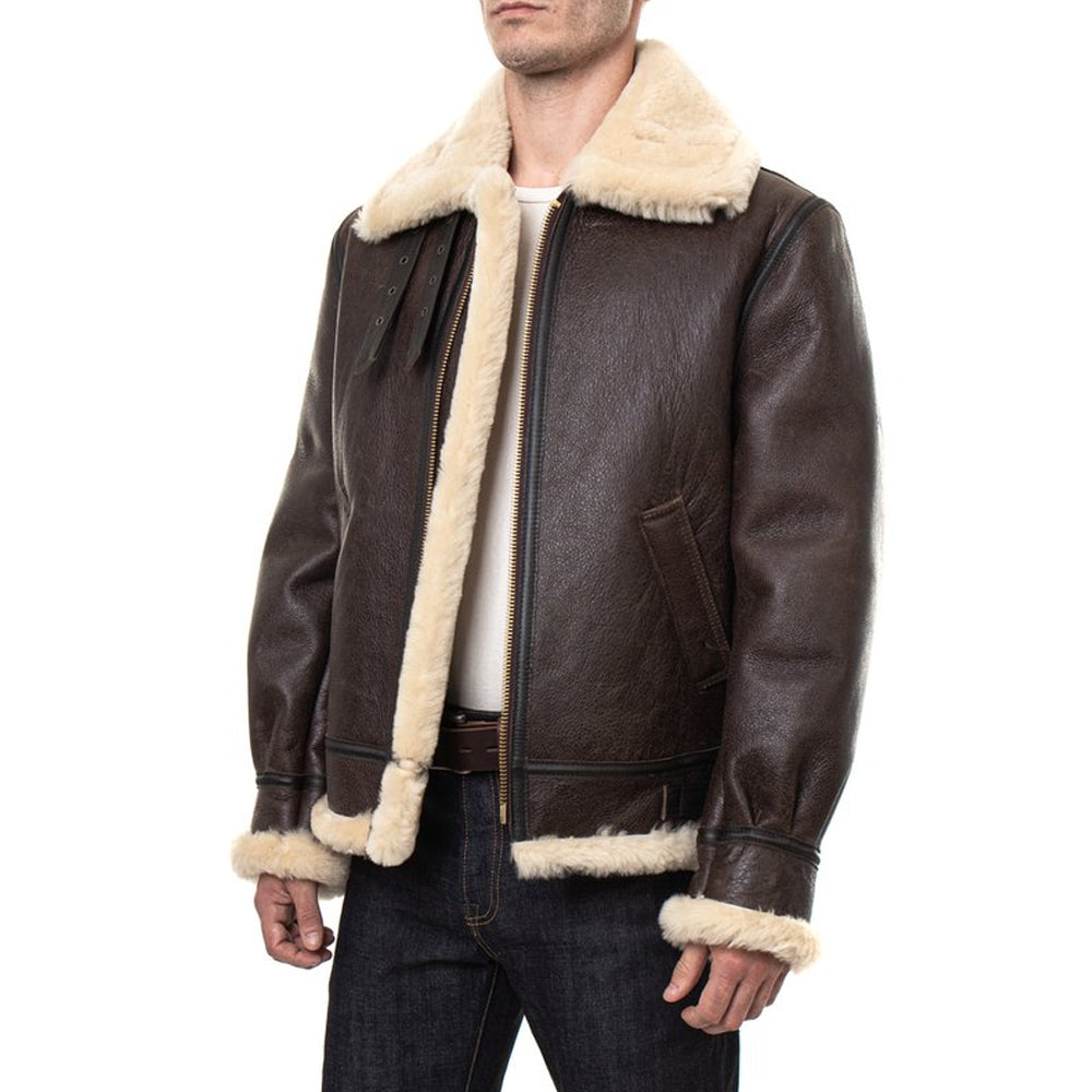 Model wearing men’s vintage brown B3 RAF aviator sheepskin bomber jacket shown in slight side view