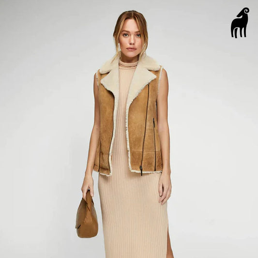 Model wearing women's shearling vest, front view, showcasing Brown suede leather and fur lining.