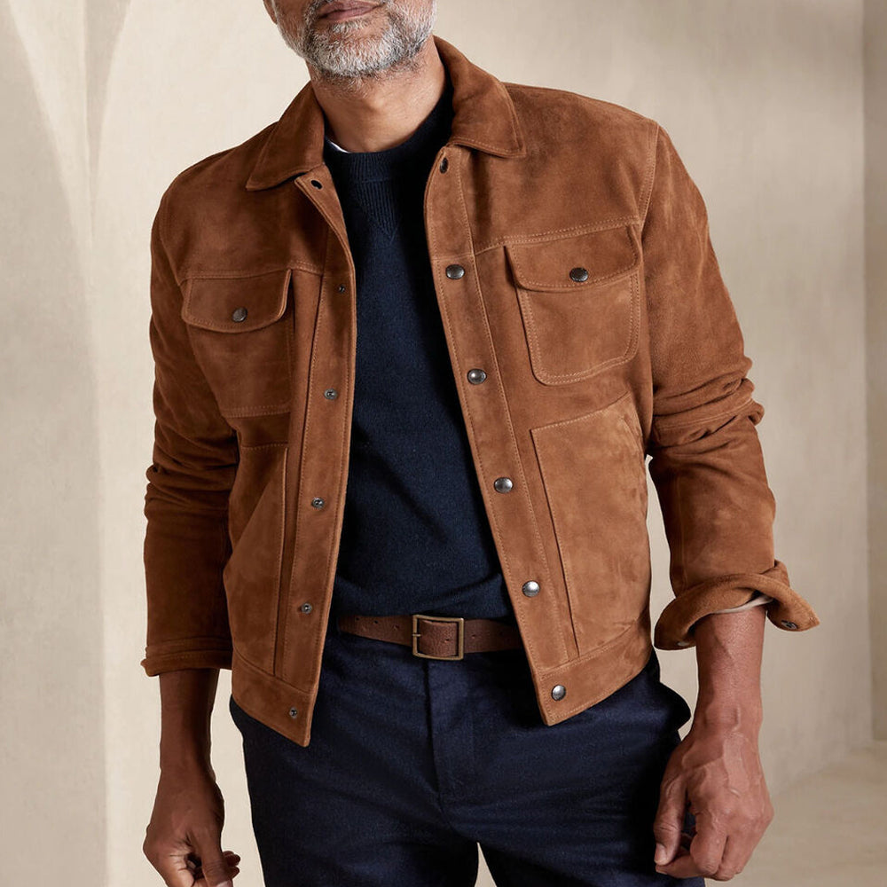 Man wearing a brown suede leather jacket with the front open, showcasing the inner lining and relaxed style.