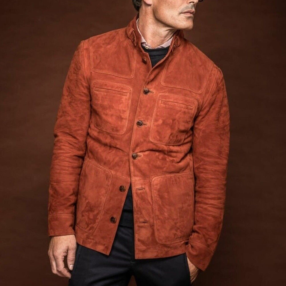 Man wearing a men's brown suede lambskin leather jacket with a buttoned-up front, looking to the side, and hand in pants pocket for a stylish pose.