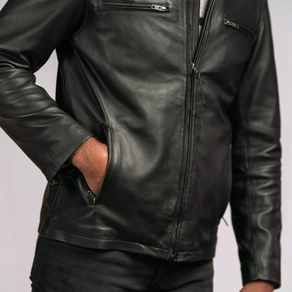 Close-up of the leather texture and stitching on the vintage bomber jacket.