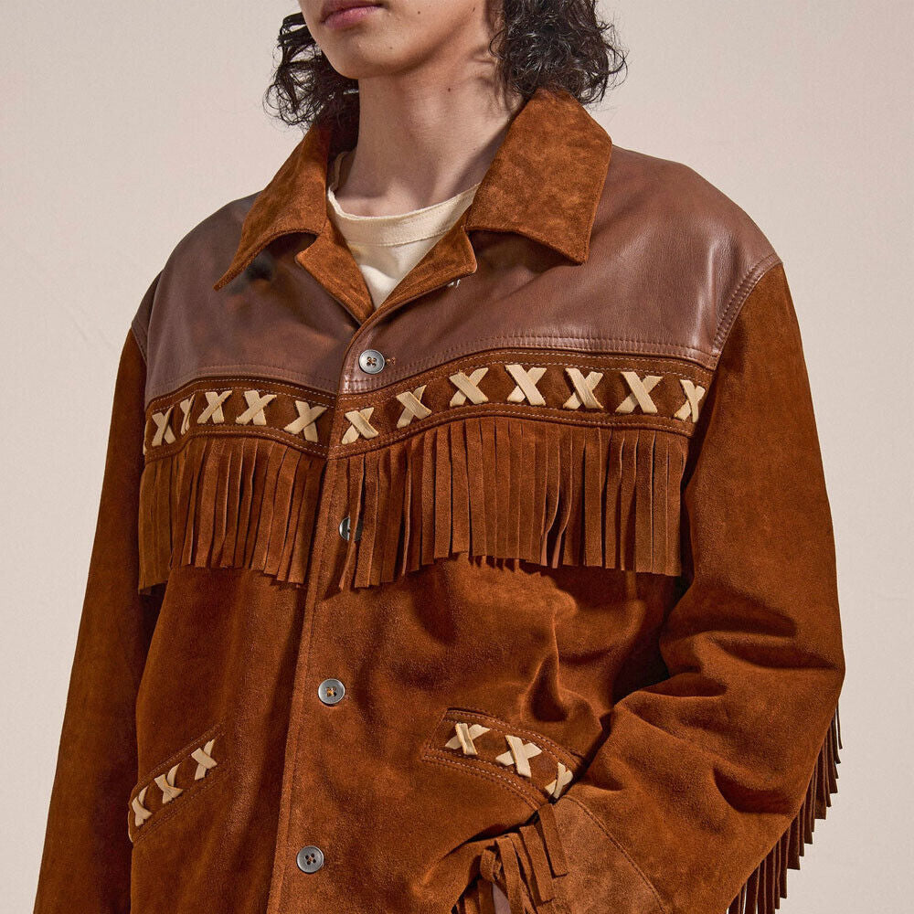 Close-up of the Men's Western Fringe Jacket worn by a model, showcasing intricate details like fringes, buttons, and stitching.