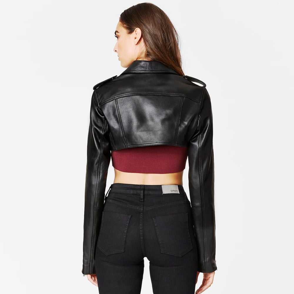 Woman wearing black cropped leather bolero jacket, back pose.