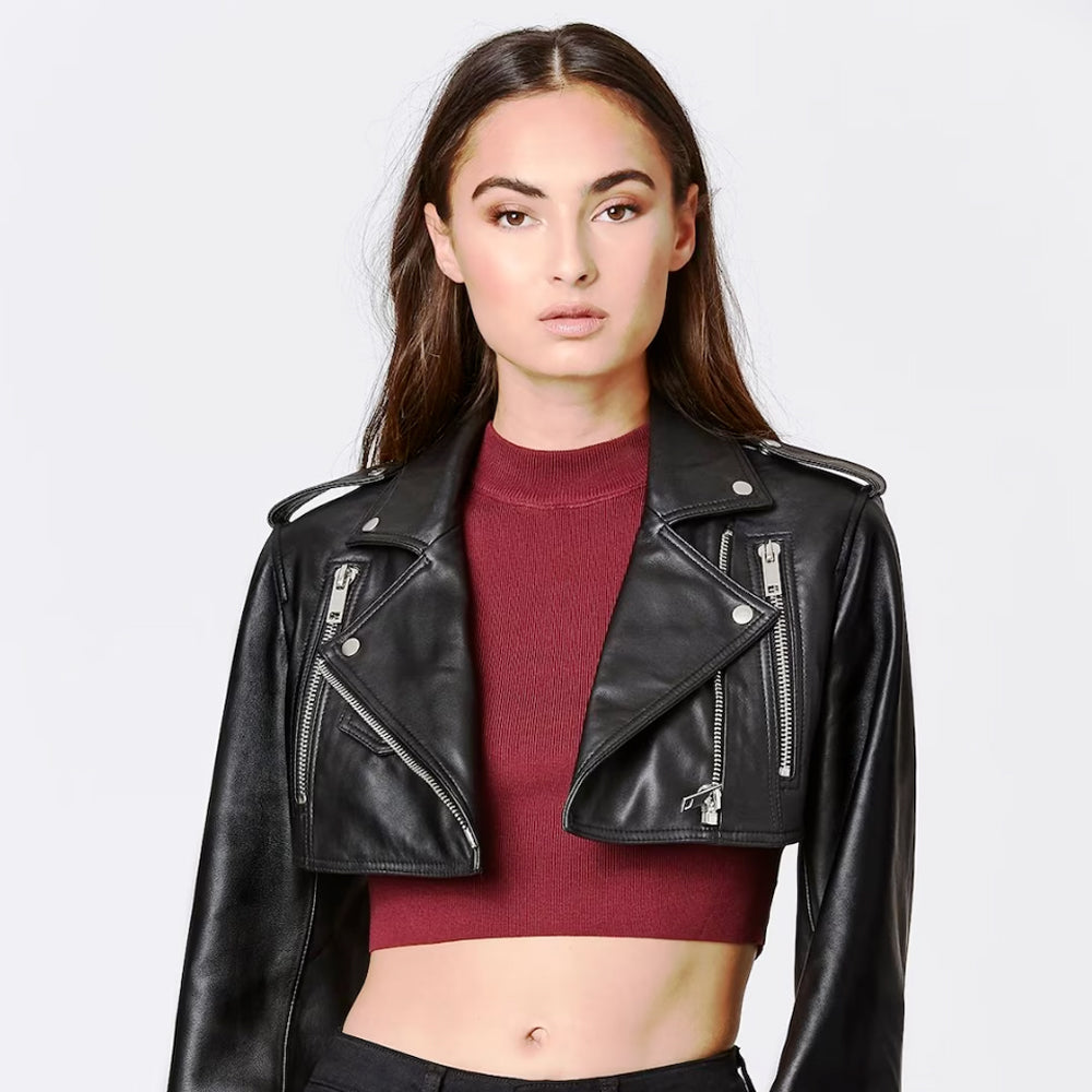 Close-up view of woman wearing black cropped leather bolero jacket, front detail.