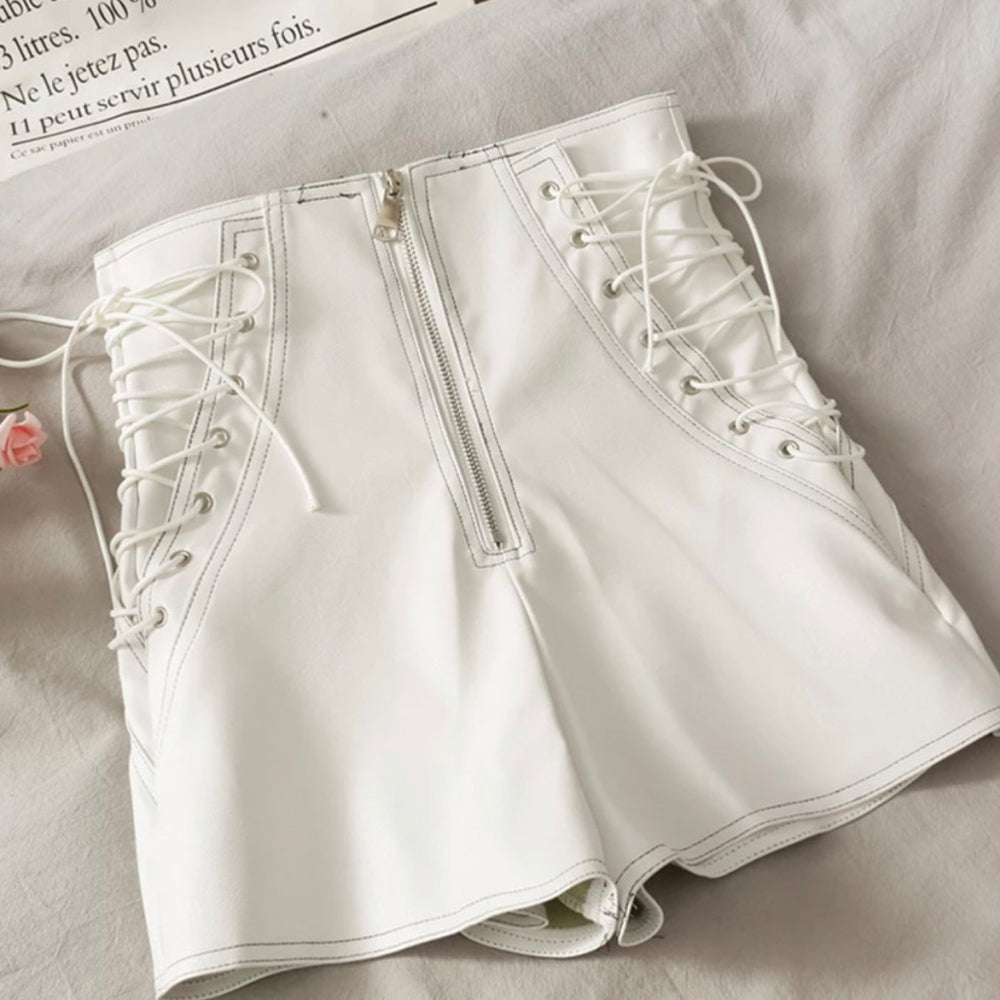 Front view of women's white leather shorts with stitched details.