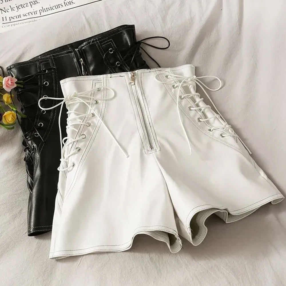 Soft lambskin white leather shorts laid flat with lace details.