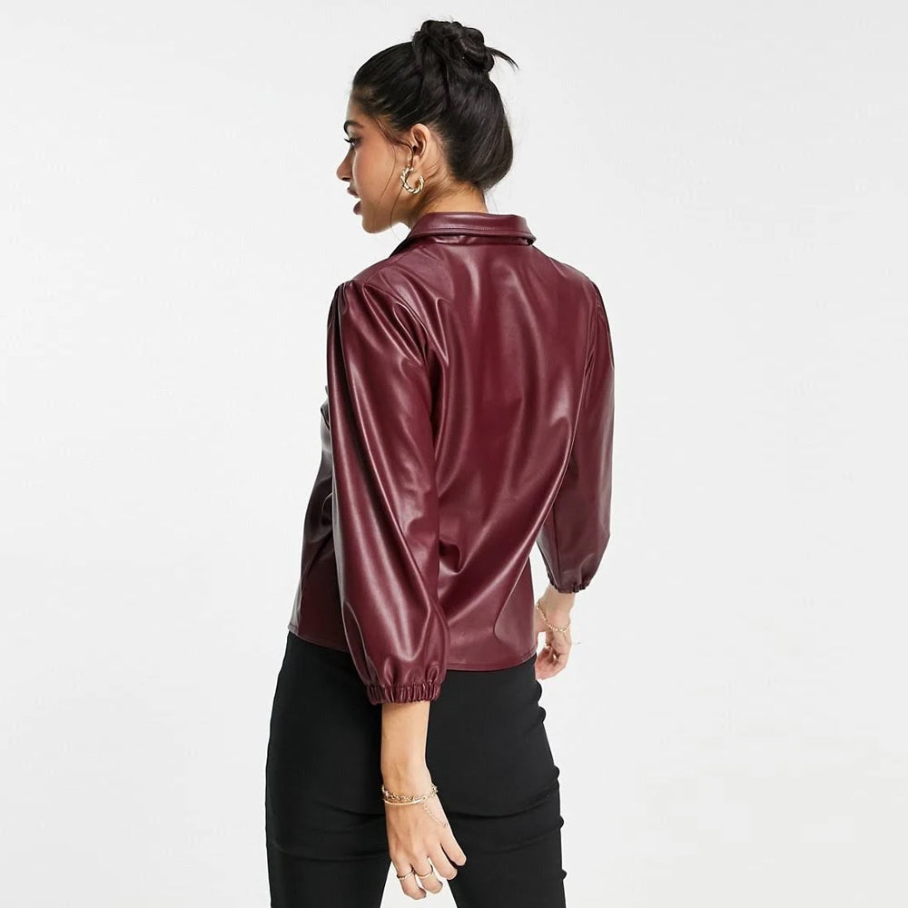 Back view of woman wearing a wine-red sheepskin leather balloon sleeve shirt, highlighting the elegant design.