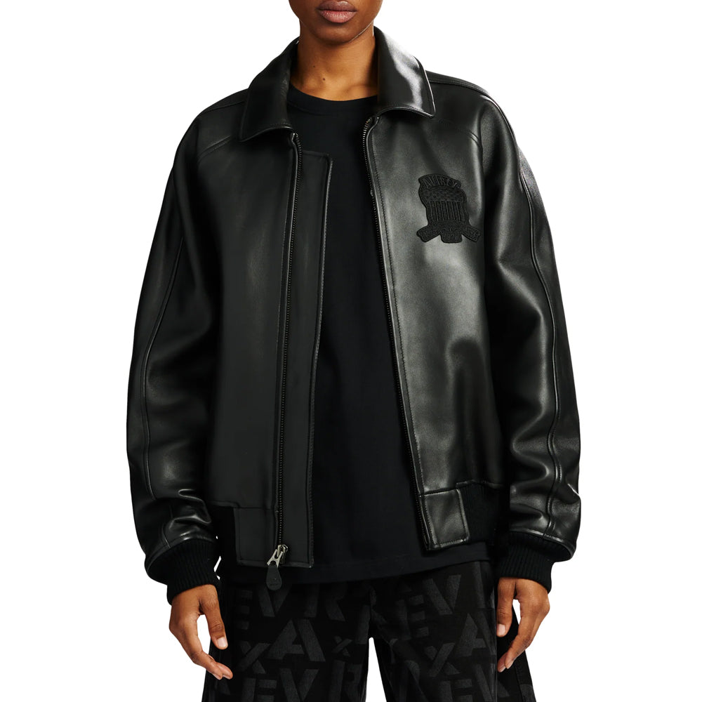 Open styling view of black Avirex Icon bomber showing tonal chest badge, smooth leather facings and relaxed layering fit