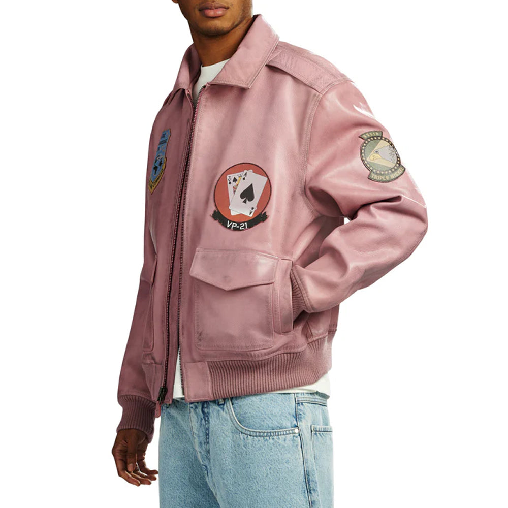 Side view of pink Avirex flight jacket with hand in flap pocket