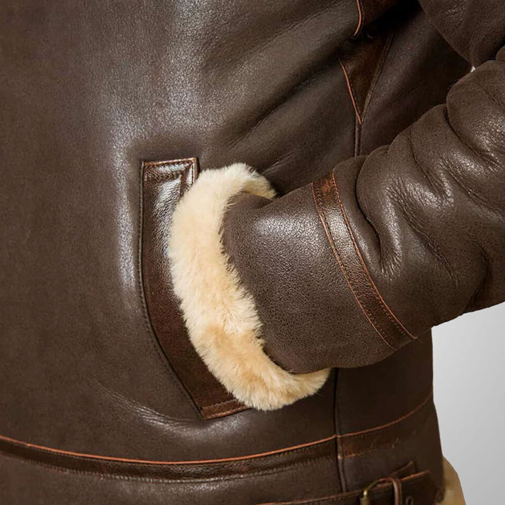Close up detail of hand inside plush shearling fur lined pocket on antiqued mocha B3 jacket